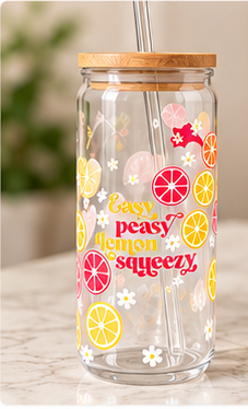 Glass tumbler with bamboo lid and straw, decorated with citrus slices and 'easy peasy lemon squeezy' lettering